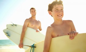 Dad and son going surfing